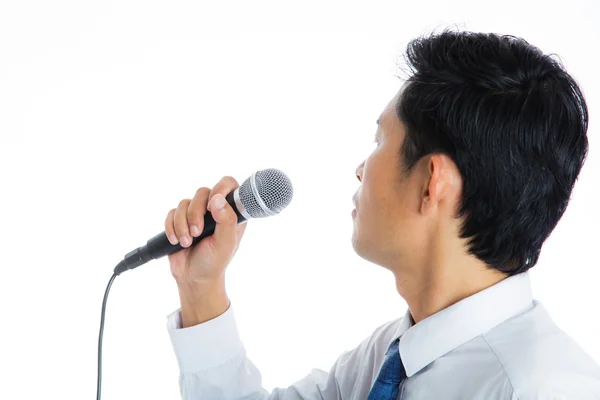 Hand holding a microphone — Stock Photo, Image
