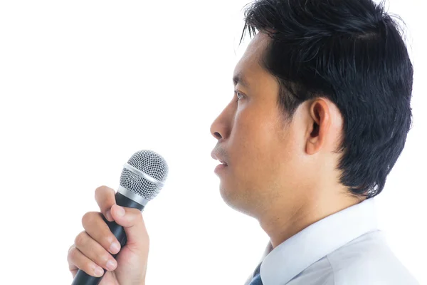 Hand holding a microphone — Stock Photo, Image