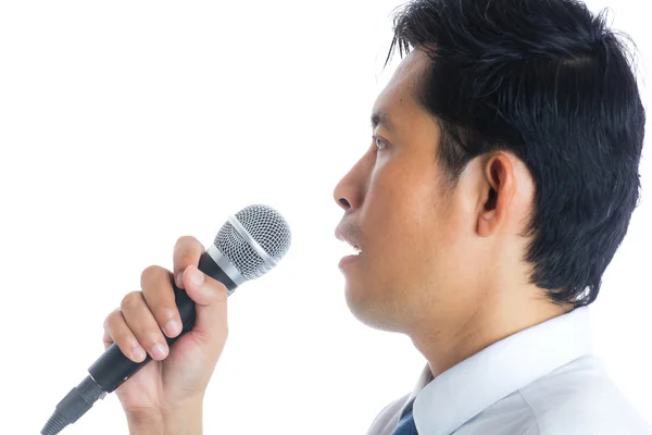 Hand holding a microphone — Stock Photo, Image