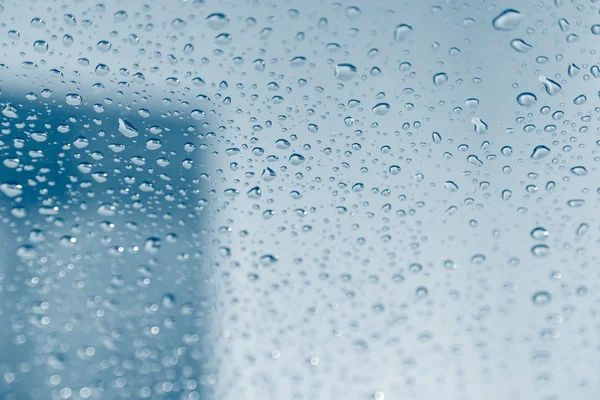 Chuva sobre textura de fundo de vidro — Fotografia de Stock