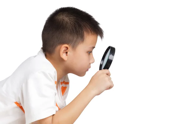 Niño sosteniendo una lupa —  Fotos de Stock