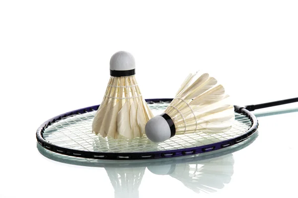 Shuttlecock on badminton racket — Stock Photo, Image