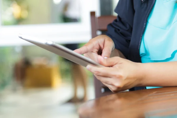 Cropped view of women using a digital tablet — Stock Photo, Image