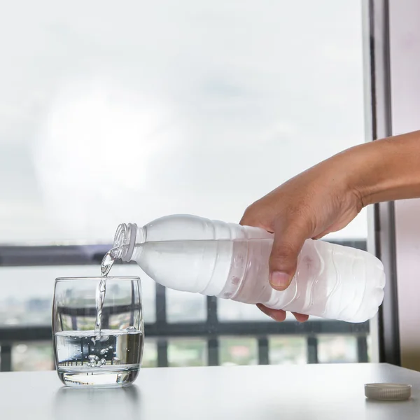 Pouring water into a glass — Stock Photo, Image
