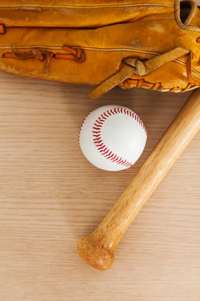 Baseball equipment on wood background