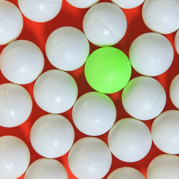 Green ball and white balls — Stock Photo, Image