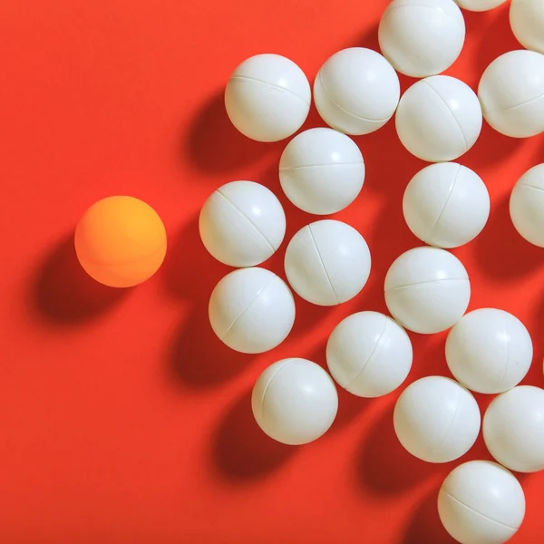 Orange ball and white balls — Stock Photo, Image