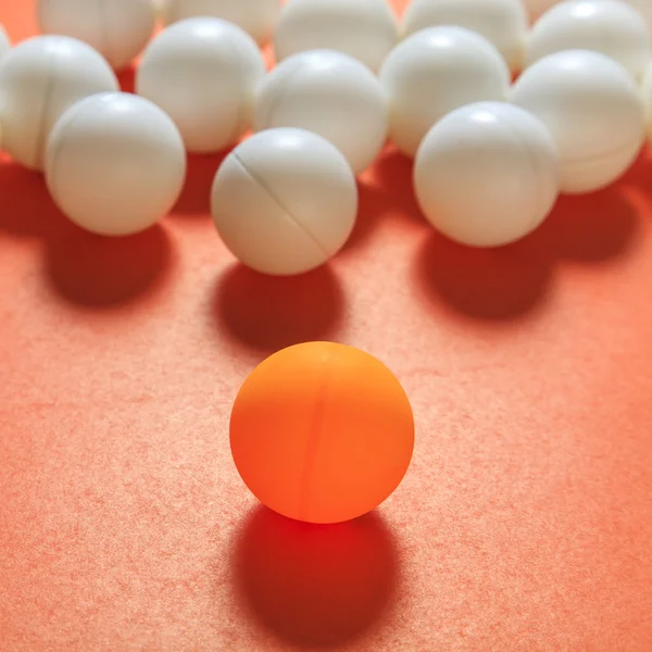 Orange ball and white balls — Stock Photo, Image