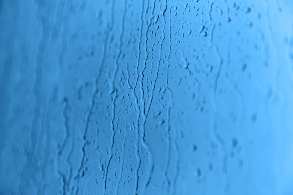 Lluvia sobre vidrio, textura de fondo —  Fotos de Stock