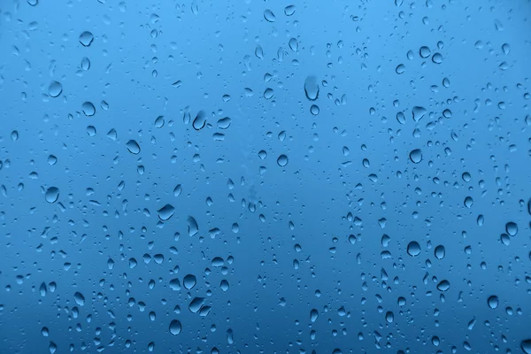 Lluvia sobre vidrio, textura de fondo — Foto de Stock