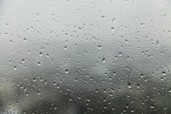 Lluvia sobre vidrio, textura de fondo — Foto de Stock