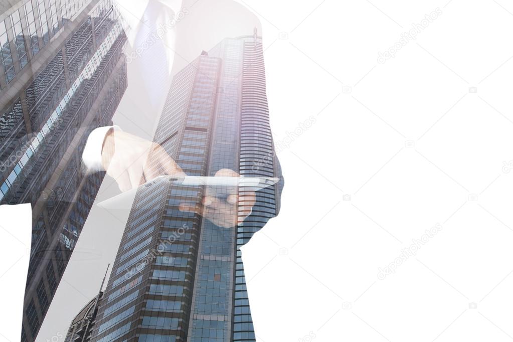double exposure of businessman and city using tablet