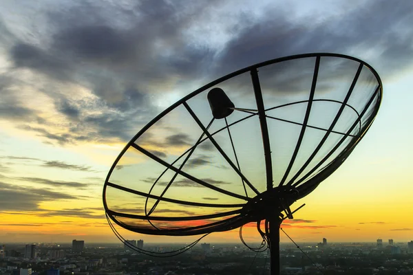 Satellite dish sky in twilight in the city — Stock Photo, Image