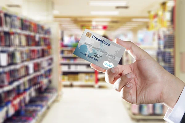 Hand holding credit card — Stock Photo, Image