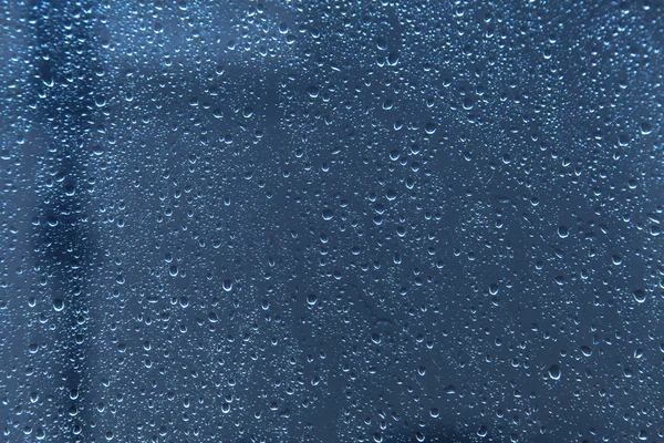 Tetesan hujan pada tekstur latar belakang kaca — Stok Foto