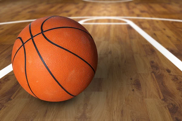 Bola de basquete sobre quadra de basquete de madeira dura — Fotografia de Stock