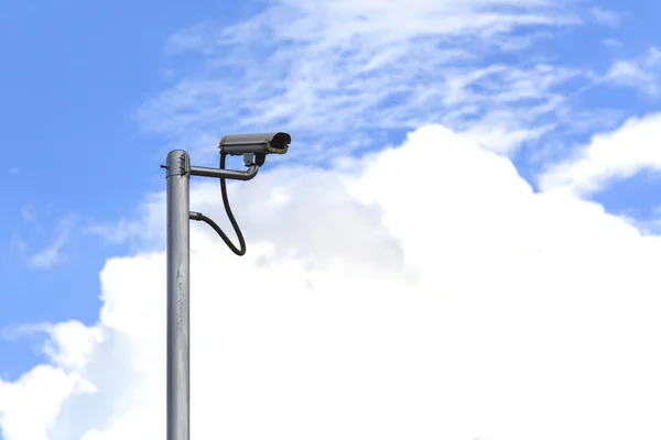 Security camera on blue sky background — Stock Photo, Image