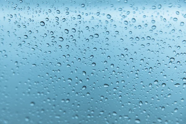ग्लास पृष्ठभूमि पर बारिश की बूंदें — स्टॉक फ़ोटो, इमेज