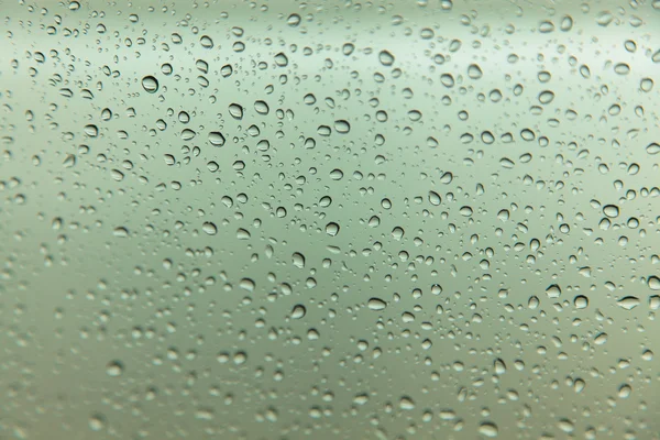 Tetesan hujan pada latar belakang kaca — Stok Foto