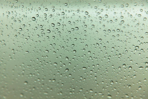 Gotas de chuva no fundo de vidro — Fotografia de Stock