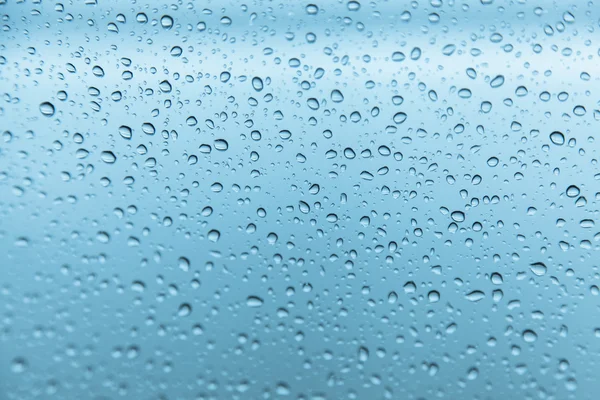 Tetesan hujan pada latar belakang kaca — Stok Foto