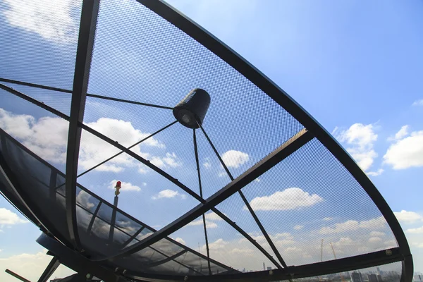 Satellite dish on blue sky — Stock Photo, Image