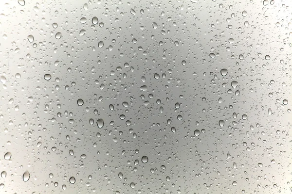 Gotas de lluvia sobre fondo de vidrio —  Fotos de Stock