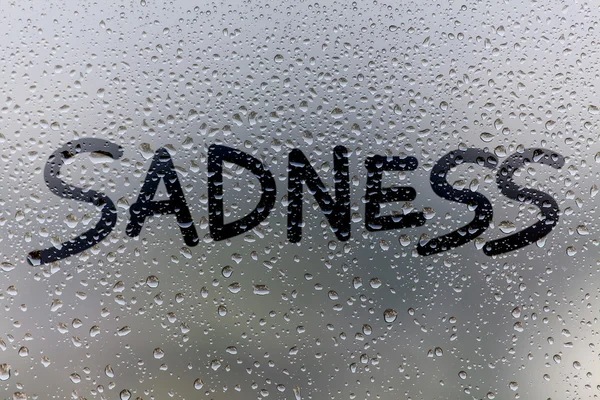 Sadness concept on glass surface — Stock Photo, Image