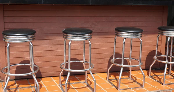 empty bar stools in a bar in chiang mai