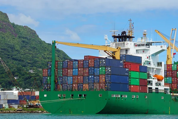 Container vessel in tropical harbor — Stock Photo, Image