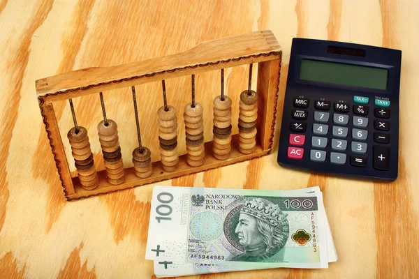 Polish money, calculator and old abacus — Stock Photo, Image