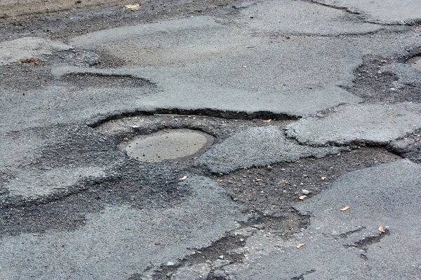 Bad road asphalt — Stock Photo, Image