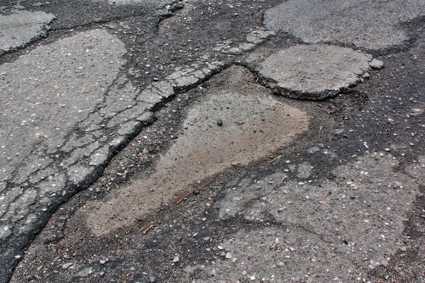 Schlechter Straßenasphalt — Stockfoto