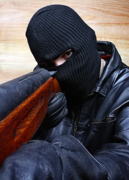 Gangster terrorist mafia criminal with a gun — Stock Photo, Image