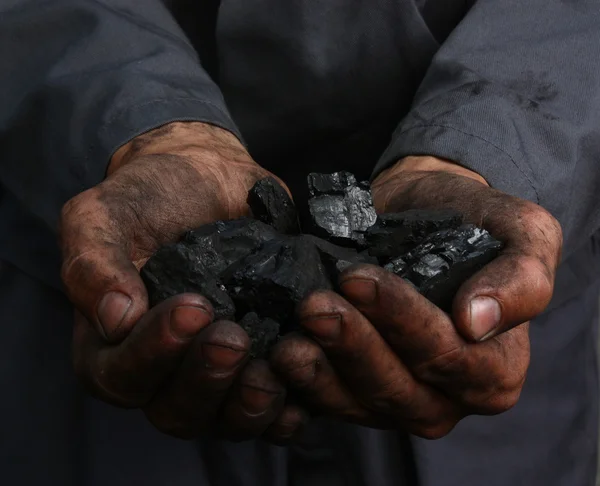 Coal in hands — Stock Photo, Image