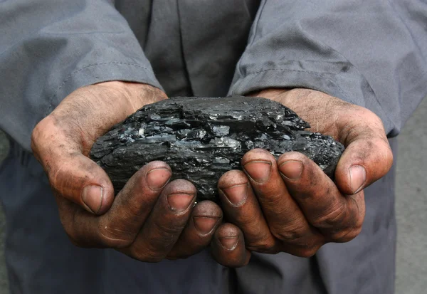 Coal in hands — Stock Photo, Image