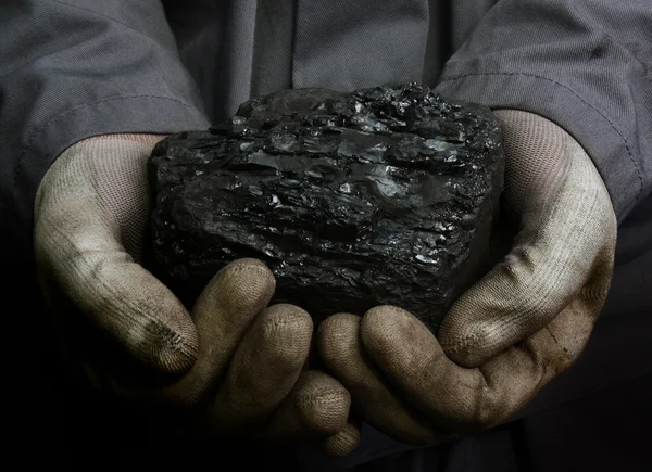 Coal in hands — Stock Photo, Image