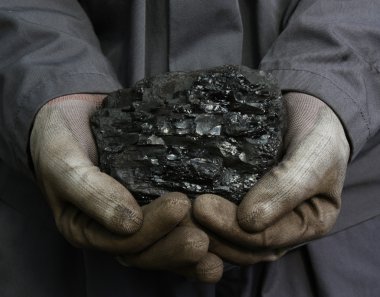 Coal in the hands clipart