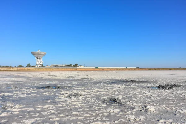 Landscape of a deserted salt lake. The texture of salt formations in the foreground. salt lake surface, dry salt lake, white salt lake