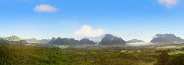 Panorama view of mountains landscape with fog on blue sky and clouds background in Phatthalung province, Southern of Thailand