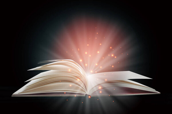 Open white paper fantasy book with shining pages isolated on black background. Miracle concept and mystery idea