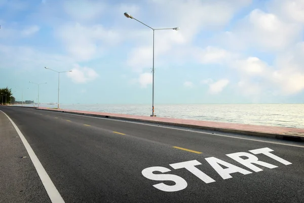 Start Word Written Asphalt Road Marking Line Given Direction Sea — Stock Photo, Image