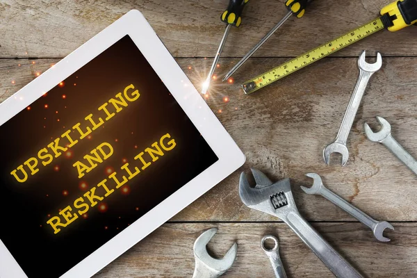Upskilling Reskilling Words Digital Computer Tablet Tools Supplies Wooden Background — Stock Photo, Image