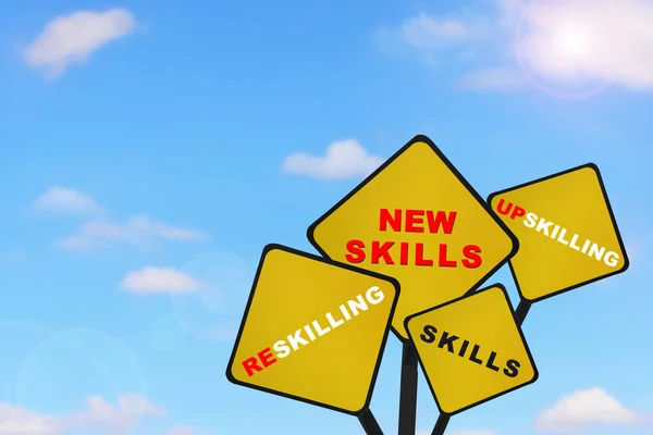 New skills, upskilling, reskilling and skills written on road sign on beautiful blue sky background with fluffy cloud. Future ahead success with education concept and self development idea