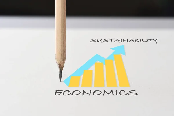 Drawing sustainable business strategy concept and future ahead idea. Economics growth graph written on white paper with pencil