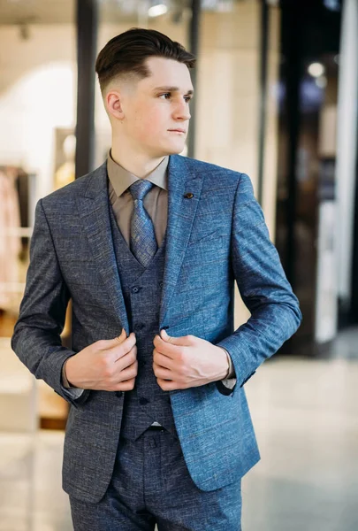 Photo of a serious focused thinking young handsome business man in a business center. — Fotografia de Stock