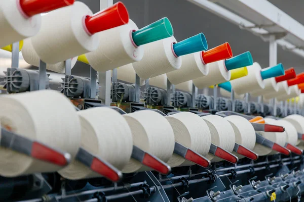 Yarn or thread production line. Automatic bobbin winding — Stock Photo, Image