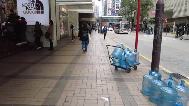 Hong Kong, China, 19 Jan 2021 : Slow motion of People walk in Canton Road, Tsim Sha Tsui . Tsim Sha Tsui is one of the major shopping areas in Hong Kong. — Stock Video