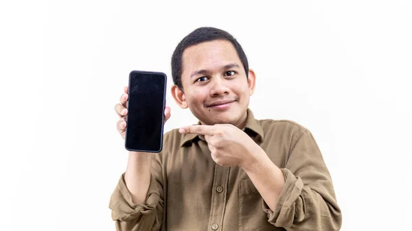 Smiling Face Expression Young Asian Malay Man Holding Smartphone Pointing — Fotografia de Stock