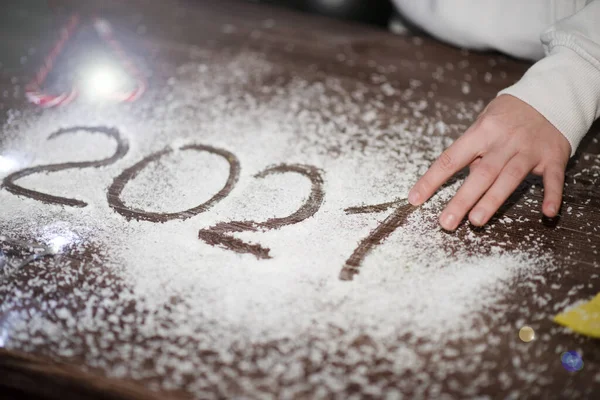 New Year. The numbers 2021 are handwritten on the coconut flakes table. — Stock Photo, Image